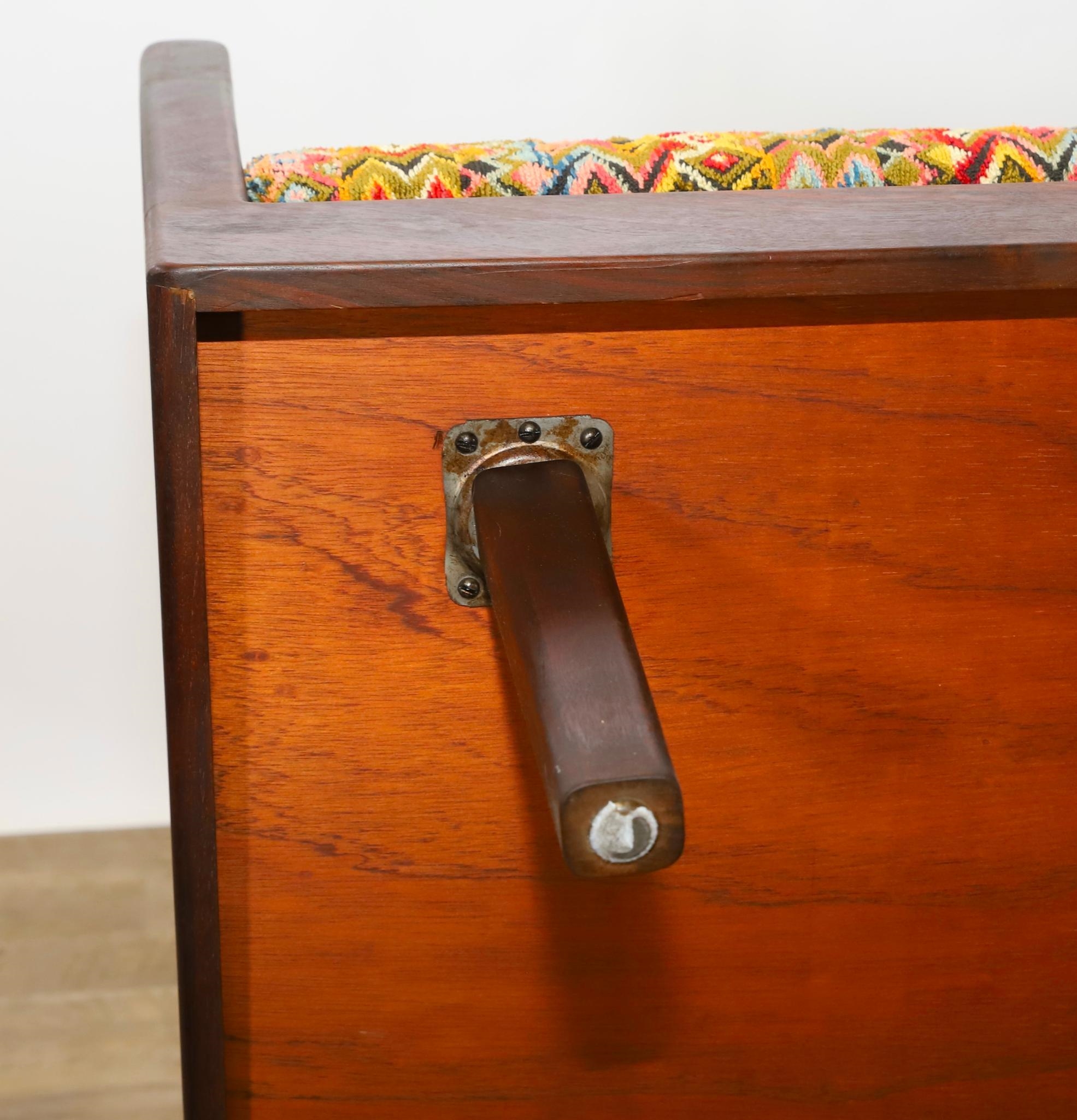 Artwork by Harvey Lowe, Sofa on slightly tapered square legs with multicolored diamond flame upholstered removable seat and back cushions, Made of olive green upholstery