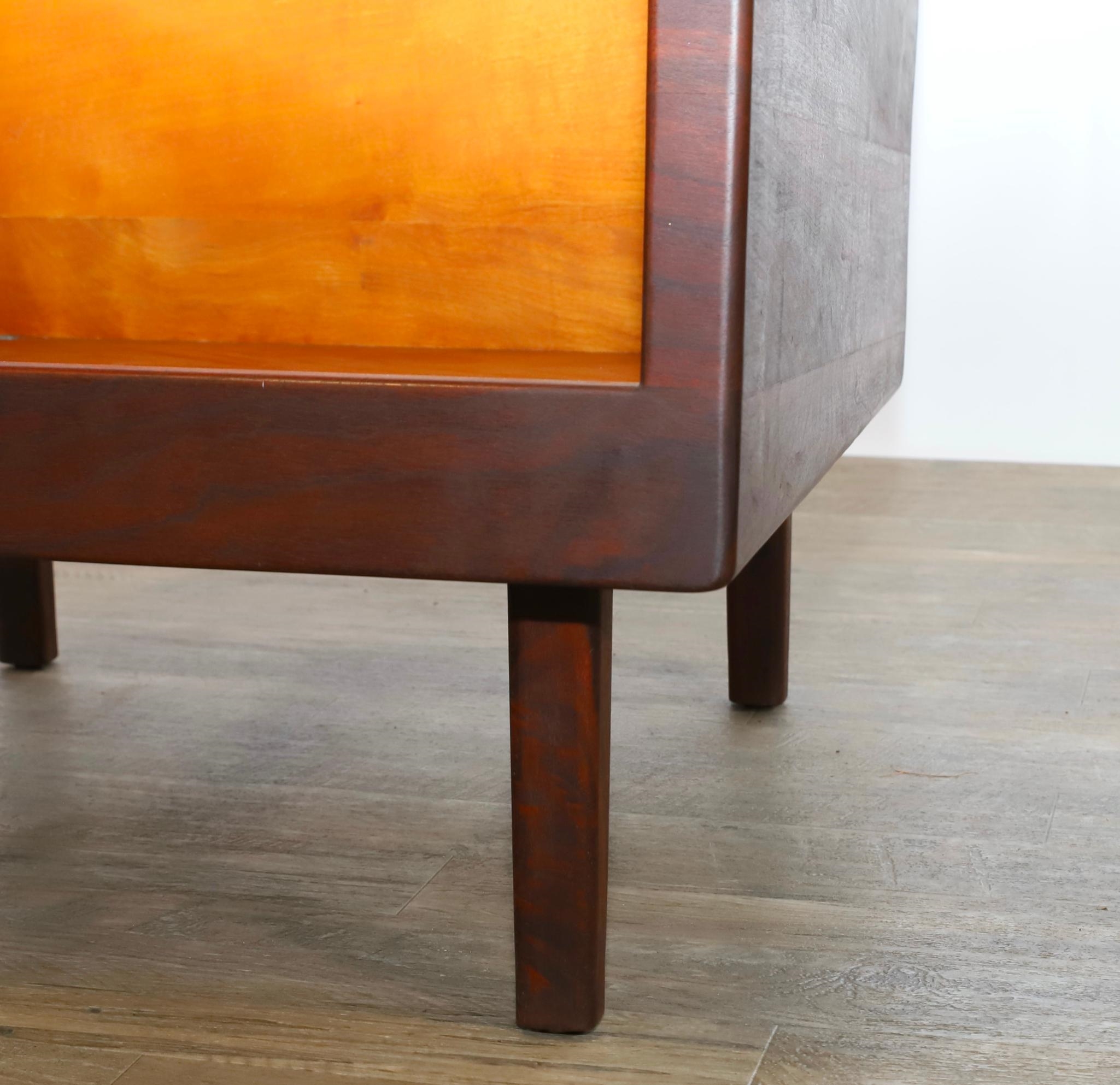 Artwork by Harvey Lowe, Sofa on slightly tapered square legs with multicolored diamond flame upholstered removable seat and back cushions, Made of olive green upholstery