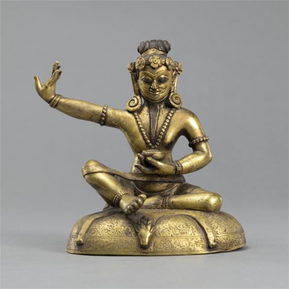 Nepalese School A SEATED GILT BRONZE MAHASIDDHA ON A CUSHION (2007