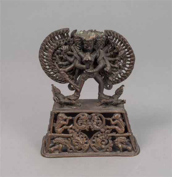 A BRONZE FIGURE OF A TANTRIC DEITY IN YAB-YUM ON AN OPENWORK PEDESTAL by Nepalese School, 2007