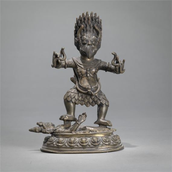 A BRONZE TANTRIC WRATHFUL GARUDA STANDING ON A FEMALE DRAGON FIGURE ON A BASE by Nepalese School, 2007
