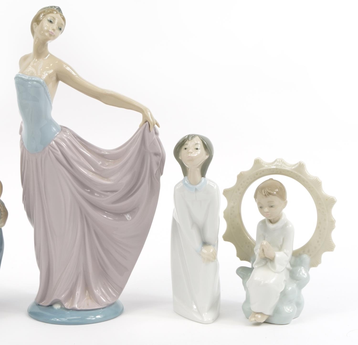 Lladró S.A Six Lladro and Nao figures and figurines including a large