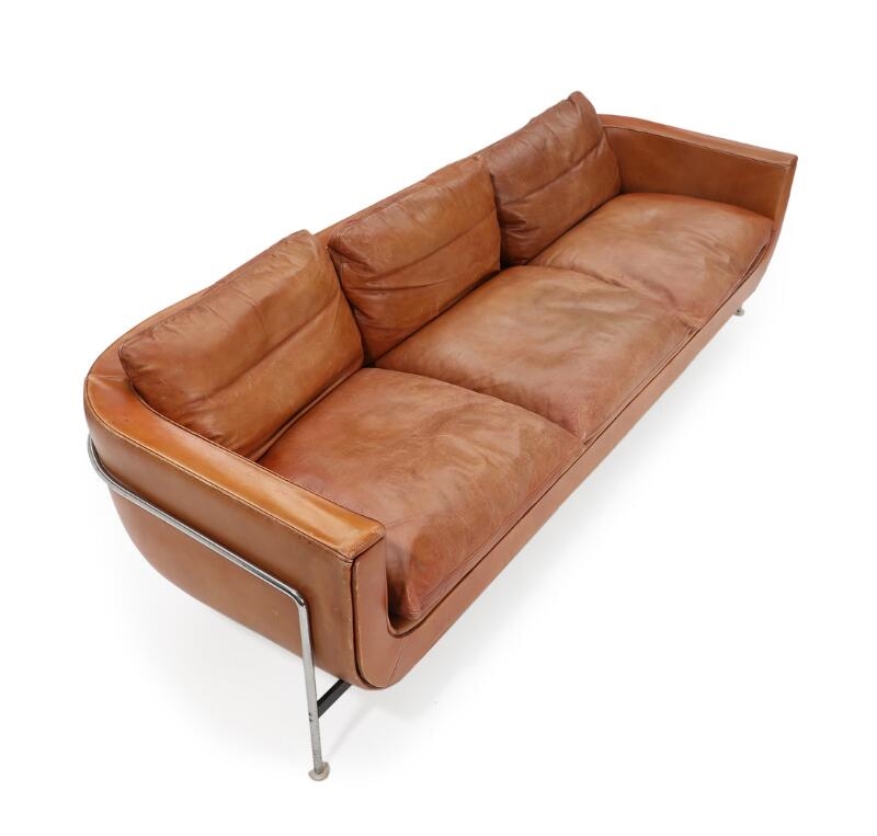 Artwork by Jacques Brule, A three seater sofa upholstered with cognac coloured leather, Made of coloured leather, chromed and black lacquered steel