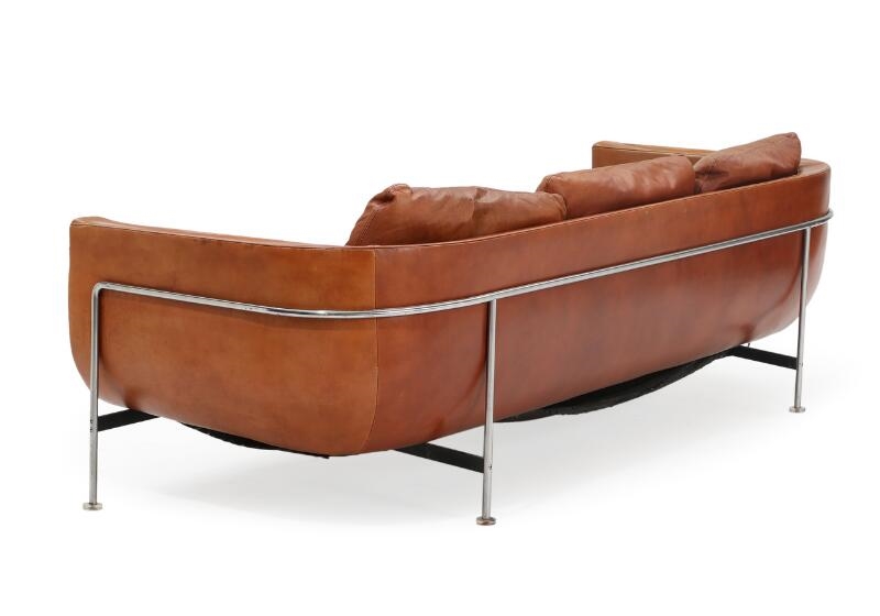 Artwork by Jacques Brule, A three seater sofa upholstered with cognac coloured leather, Made of coloured leather, chromed and black lacquered steel