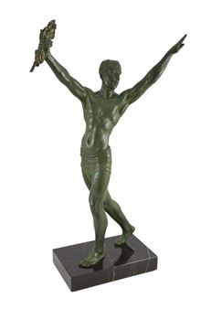 J. Darcourt. NB. An Art Deco patinated spelter figure of a victorious athlete - J. Darcourt