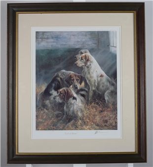 A framed print of four dogs resting in a field with soft sunlight.