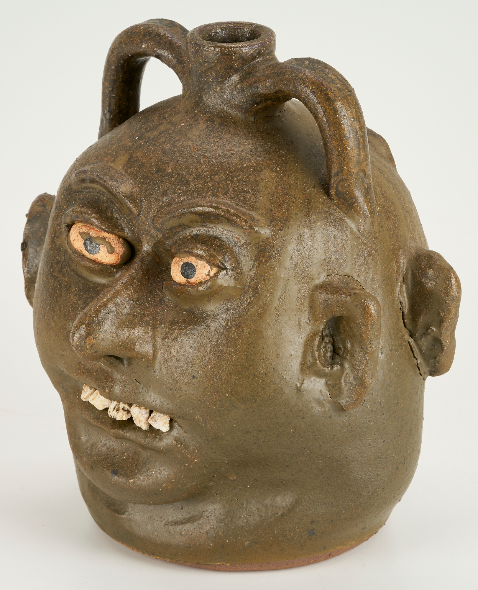 Artwork by Lanier Meaders, Lanier Meaders Folk Art Pottery Double Face Jug, Made of green matte glaze with