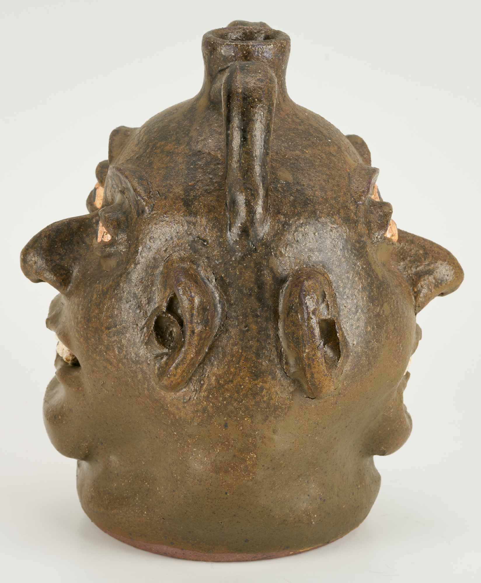 Artwork by Lanier Meaders, Lanier Meaders Folk Art Pottery Double Face Jug, Made of green matte glaze with