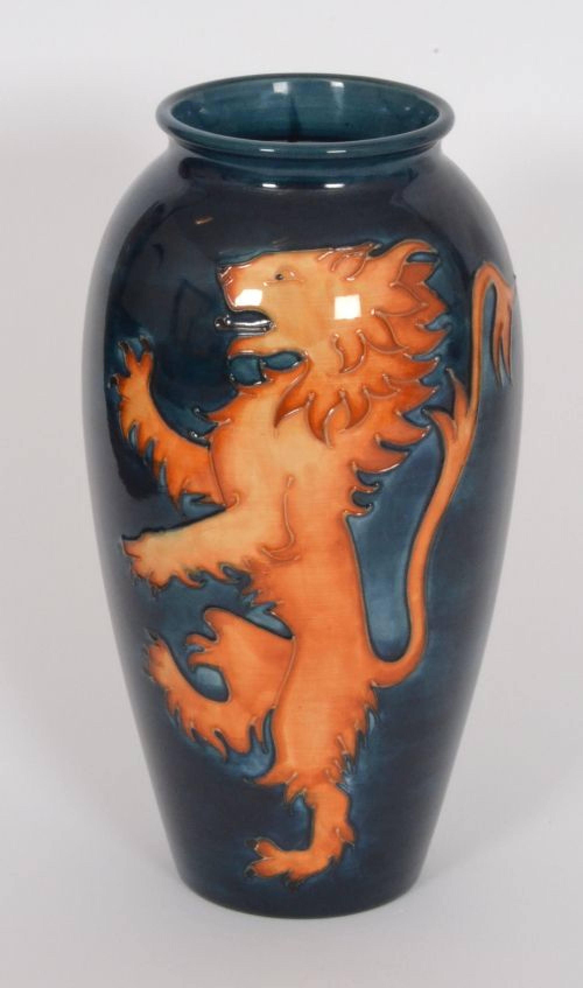 William Moorcroft | A Moorcroft Pottery vase of tapering form with roll ...