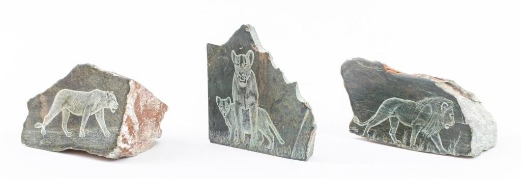 Artwork by Justie Mashile, Walking lioness, one with a lioness and cub, and the last with a lion, Made of green stone