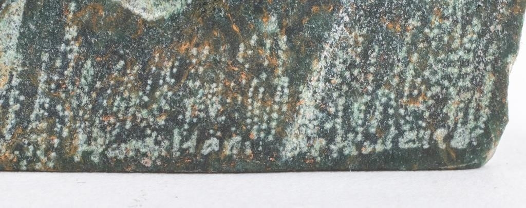 Artwork by Justie Mashile, Walking lioness, one with a lioness and cub, and the last with a lion, Made of green stone