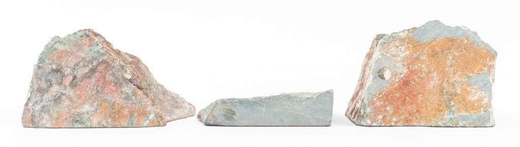 Artwork by Justie Mashile, Walking lioness, one with a lioness and cub, and the last with a lion, Made of green stone