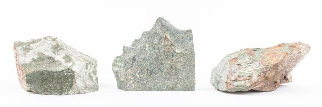 Artwork by Justie Mashile, Walking lioness, one with a lioness and cub, and the last with a lion, Made of green stone