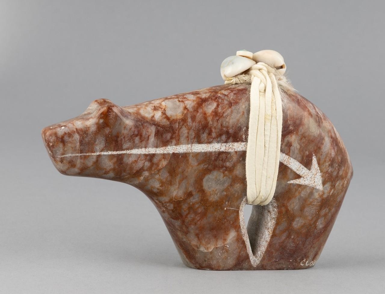 Artwork by Cloud Eagle, Bear, Made of a mottled brown stone carving of a bear