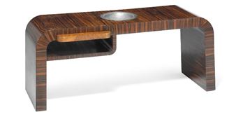 A unique Art Deco coffee table of Macassar with curvy ends and a small underlying shelf - Orla Høyer