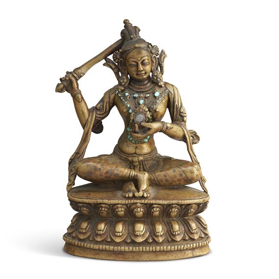 A RARE COPPER AND SILVER-INLAID FIGURE OF MAHA PRATISARA by Tibetan School, 15th Century, 15TH CENTURY