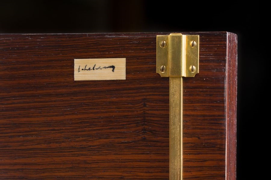 Artwork by Jules Leleu, Buffet en placage..., Made of Solid recessed base encircled by a brass band with a slight projection (wear, small detachments and veneer jumps). Keyholes and pull handles in gilded metal.