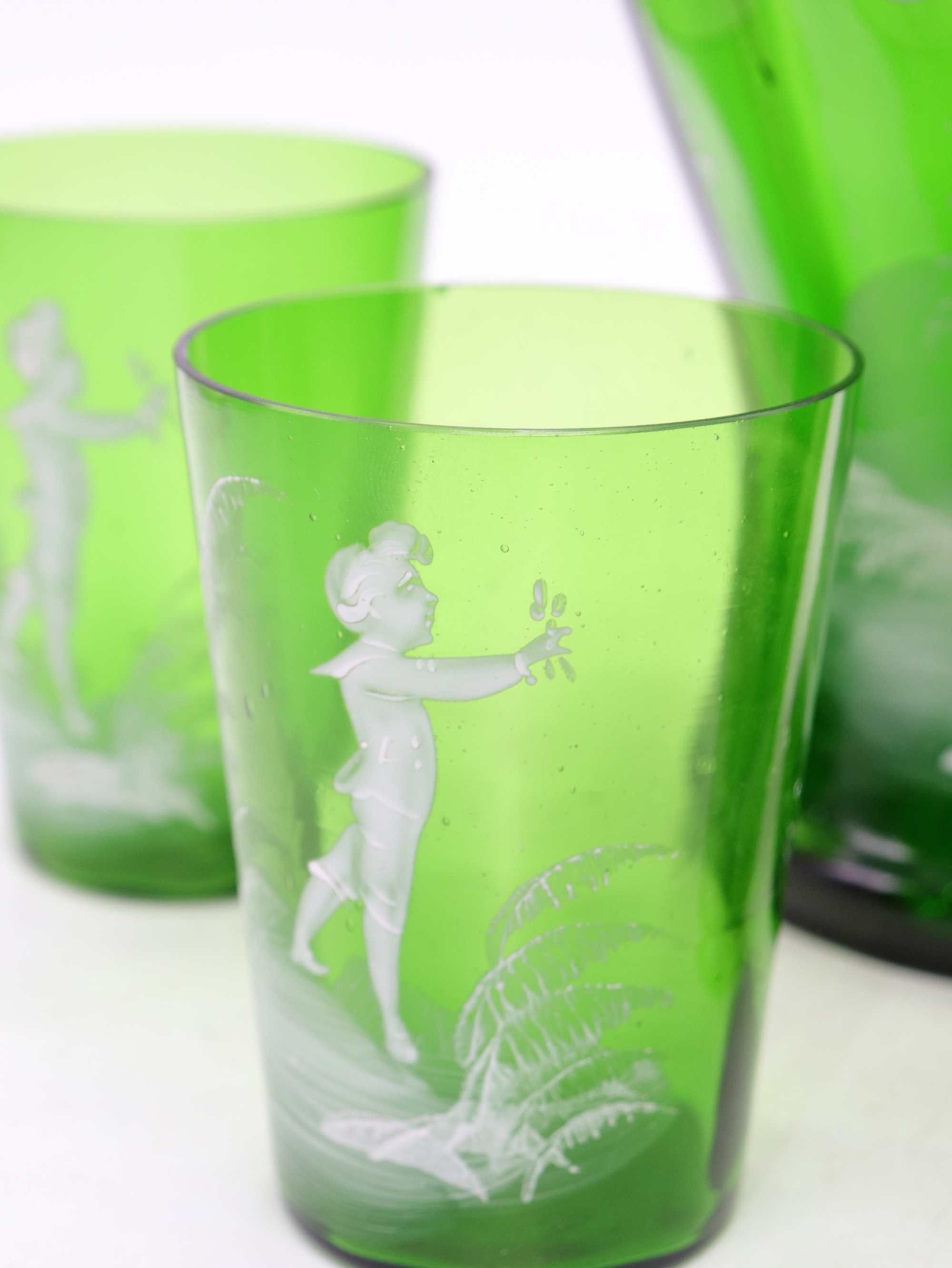 Artwork by Mary Gregory, Rare antique Mary Gregory green glass drinking set, Made of green glass