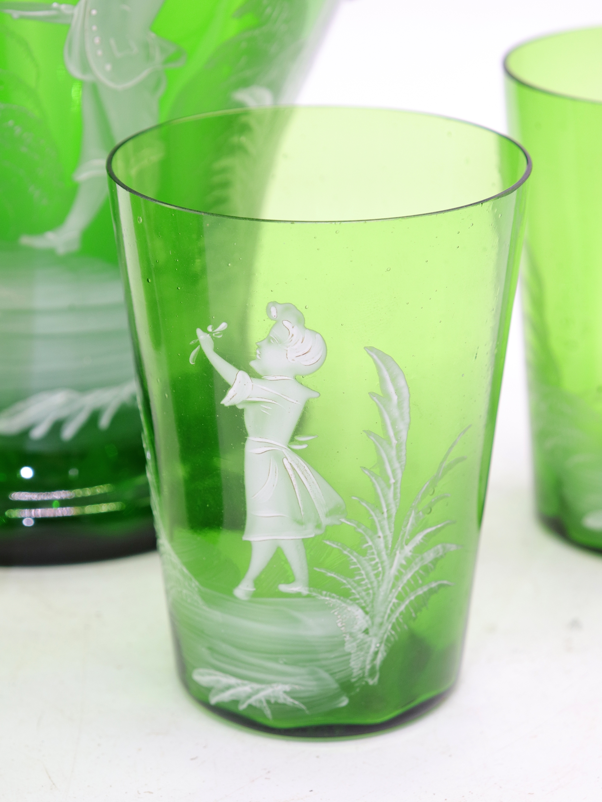Artwork by Mary Gregory, Rare antique Mary Gregory green glass drinking set, Made of green glass