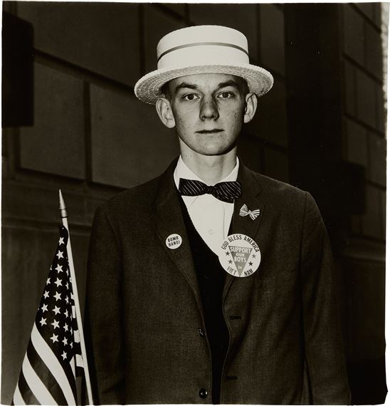 Boy with a straw hat waiting to march in a pro-war parade, N.Y.C. by Diane Arbus, 1967