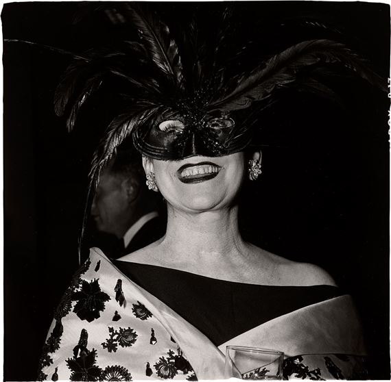 Laughing Woman in a Feather Mask, N.Y.C.