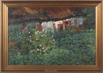 Korsvirkeshus med blommande rosor framför - Anders Trulson