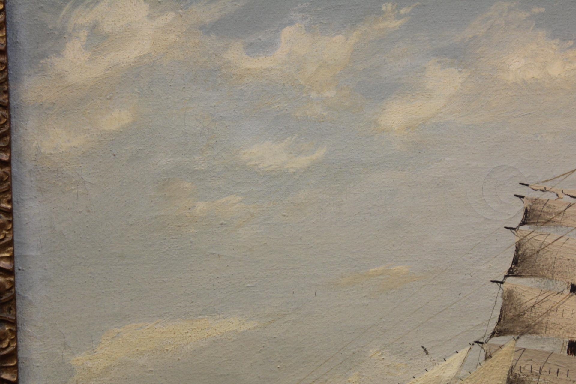 A framed maritime painting of a sailing ship navigating choppy seas under a cloudy sky.