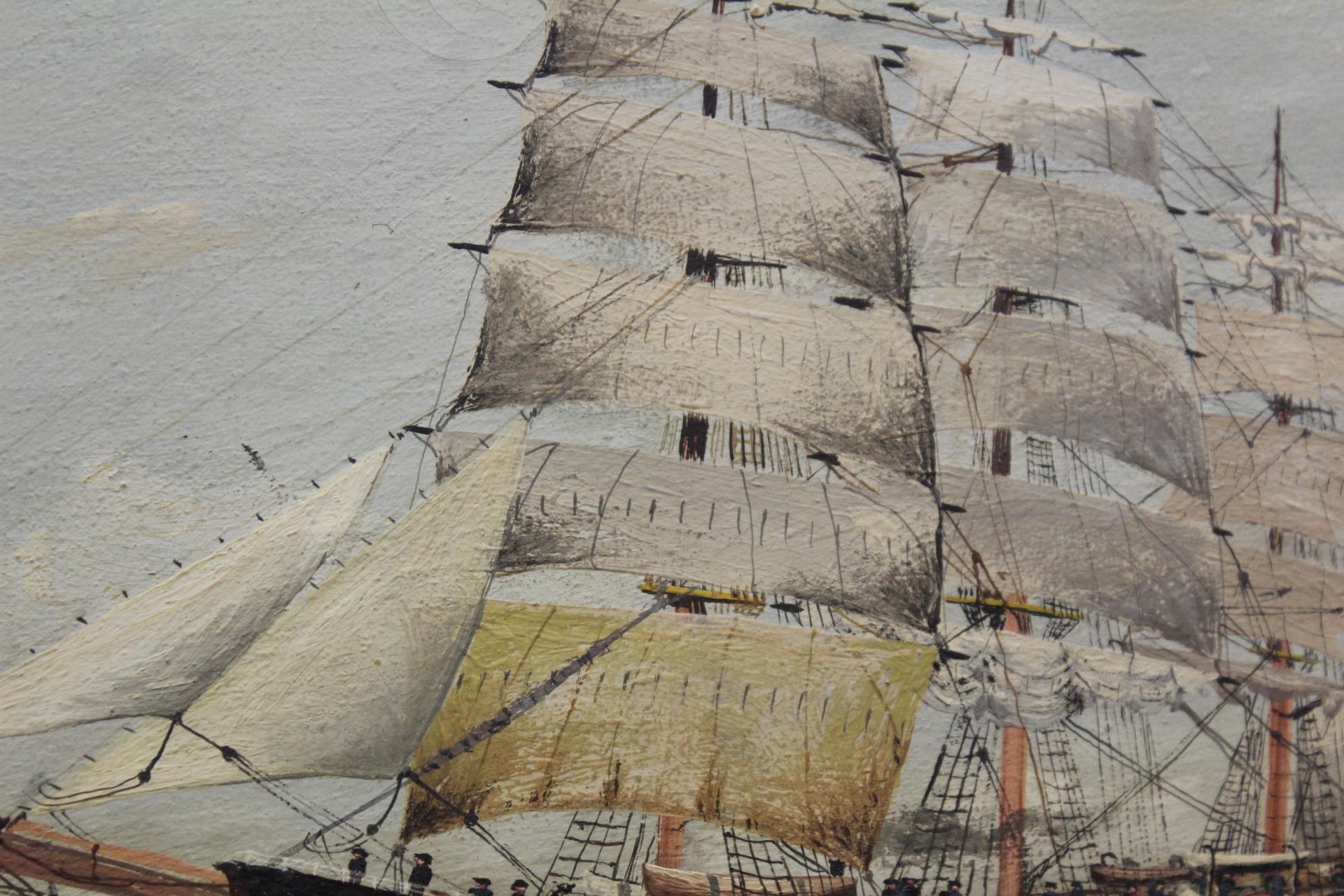 A framed maritime painting of a sailing ship navigating choppy seas under a cloudy sky.
