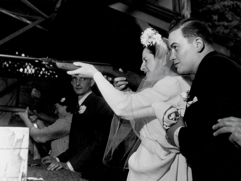 Bride and groom at the carnival by Robert Doisneau, circa 1950