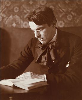 William Butler Yeats reading a book. - Alice Boughton
