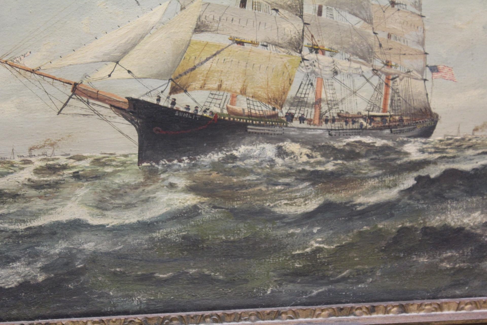 A framed maritime painting of a sailing ship navigating choppy seas under a cloudy sky.