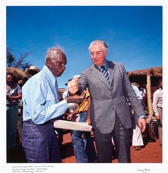 PRIME MINISTER GOUGH WHITLAM POURS SOIL INTO THE HANDS OF TRADITIONAL LANDOWNER - Mervyn Bishop