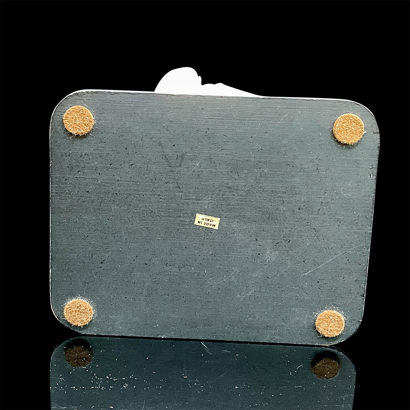 Artwork by Giuseppe Armani, Matte figure of an finely dressed lady in a jacket, skirt and pillbox style hat holding her gloves, Made of Figurine