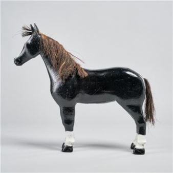 A wooden carving of a black horse by Georges Desmeules - Georges Desmeules