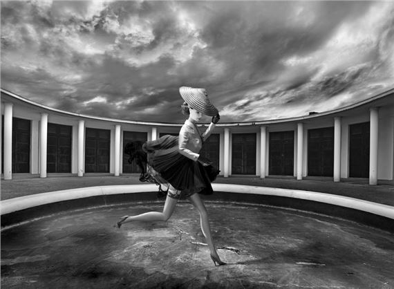 Barbie® in an outfit signed by the designer Christian Dior making a perfect replica of a 1947 model in the Pompeian Baths of Deauville