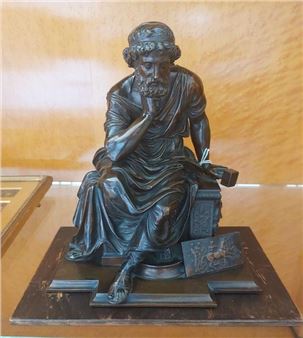 figure of Pythias, seated and holding a hammer - Huzel