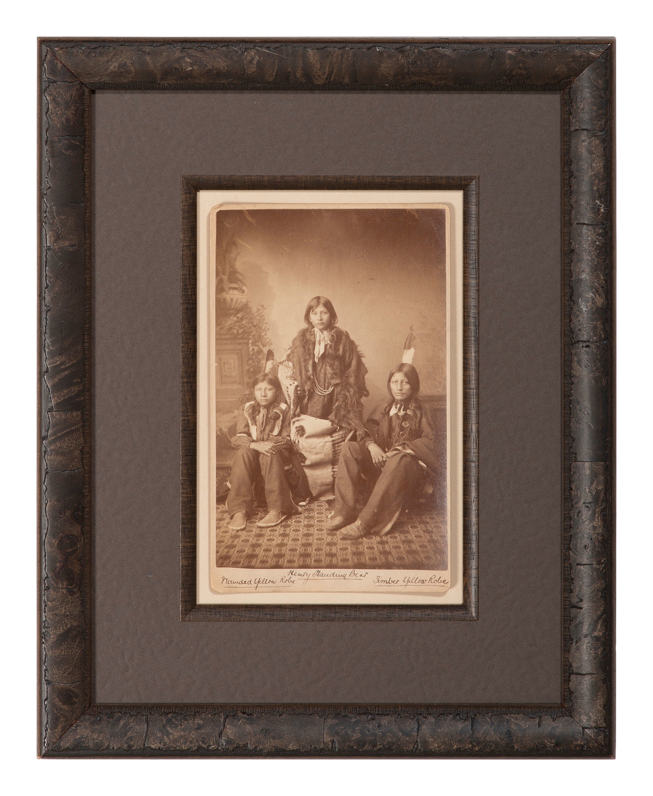 Artwork by John Nicholas Choate, Boudoir card featuring a trio of Santee Sioux students of Carlisle Indian School, identified on mount as Henry Standing Bear, Made of Boudoir card