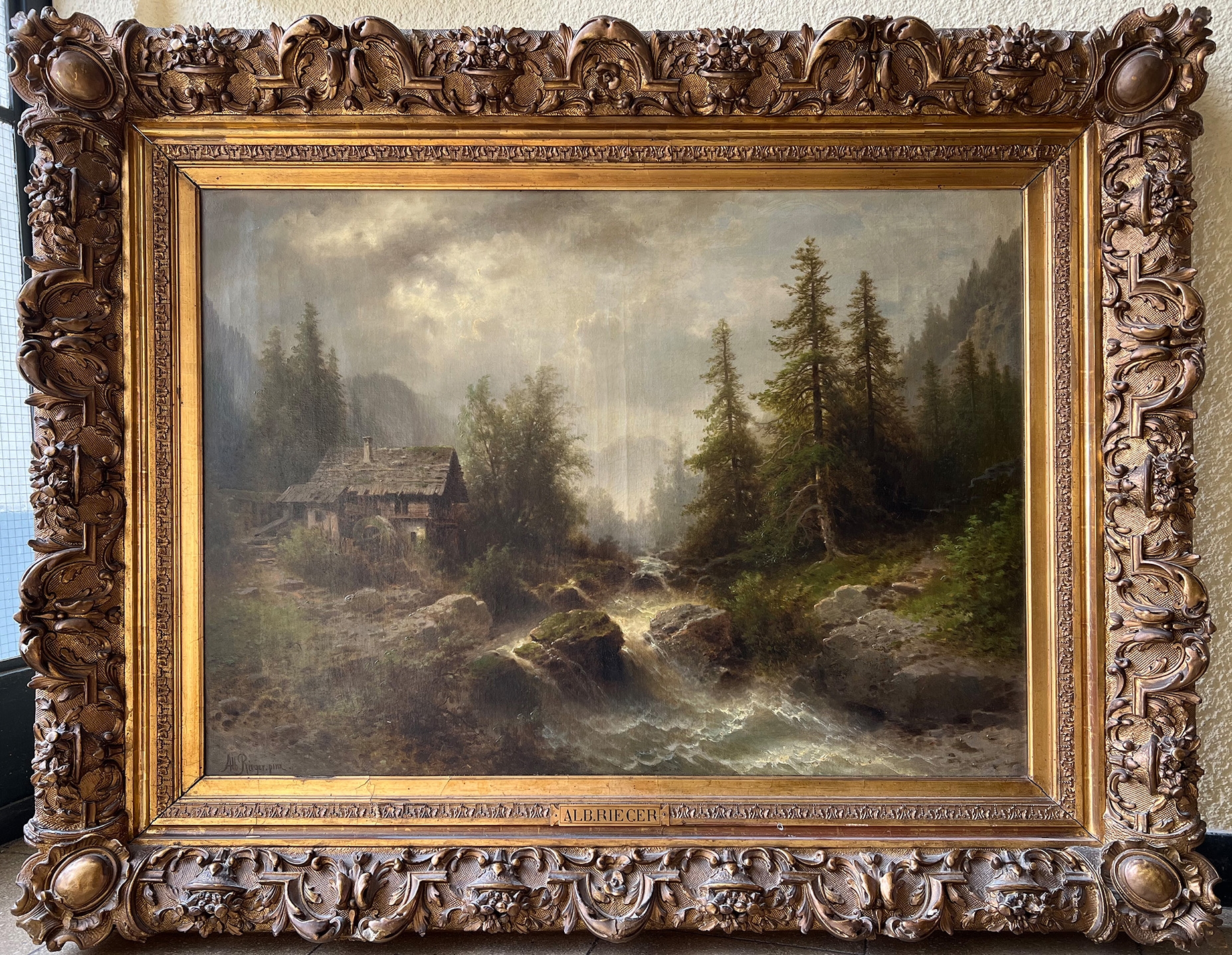 Albert Rieger | Landschaft mit Blockhaus am Wasserfall, umgeben von ...