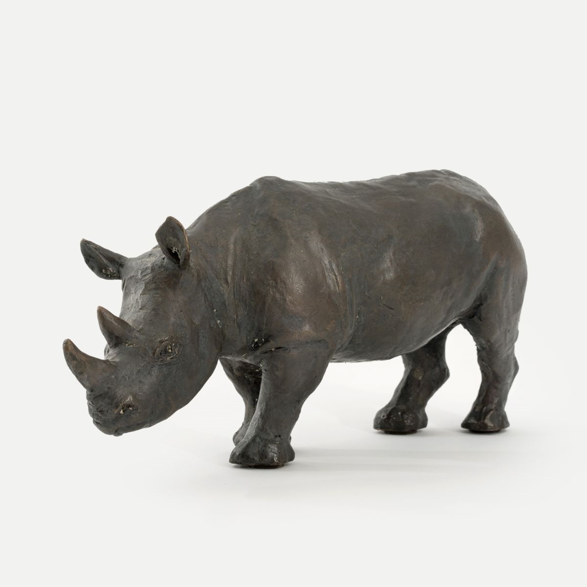 Artwork by Leo Wirth, A Rhino, Made of wood and stone