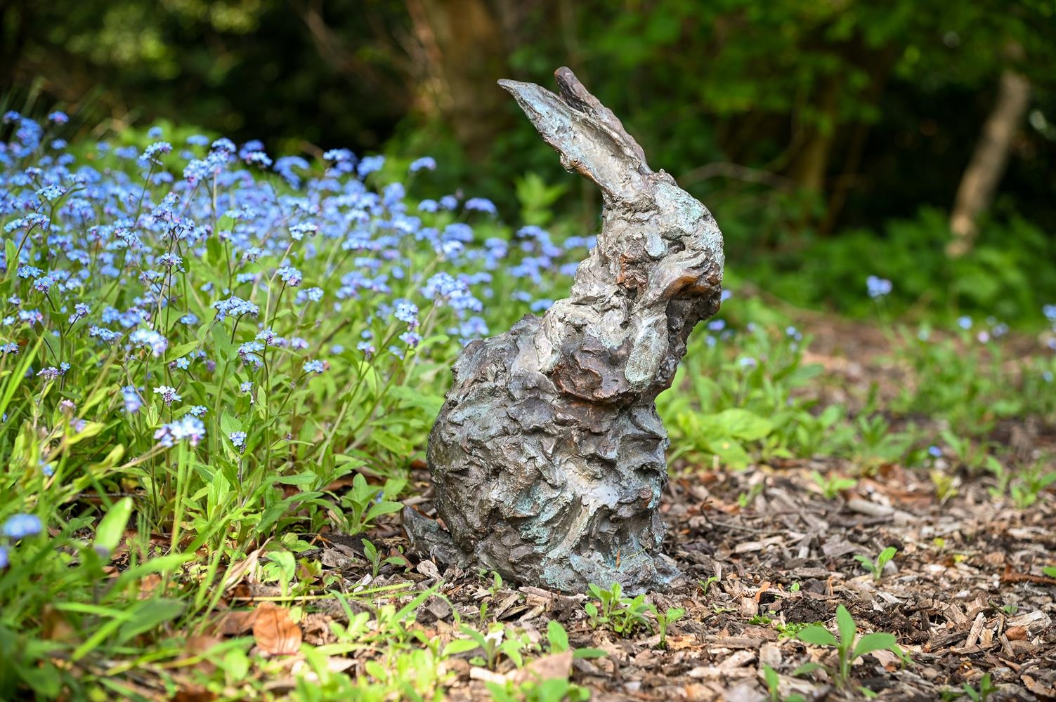 Artwork by Nicola Hicks, A LIMITED EDITION BRONZE MODEL OF A RABBIT GROOMING ITS FACE, Made of bronze