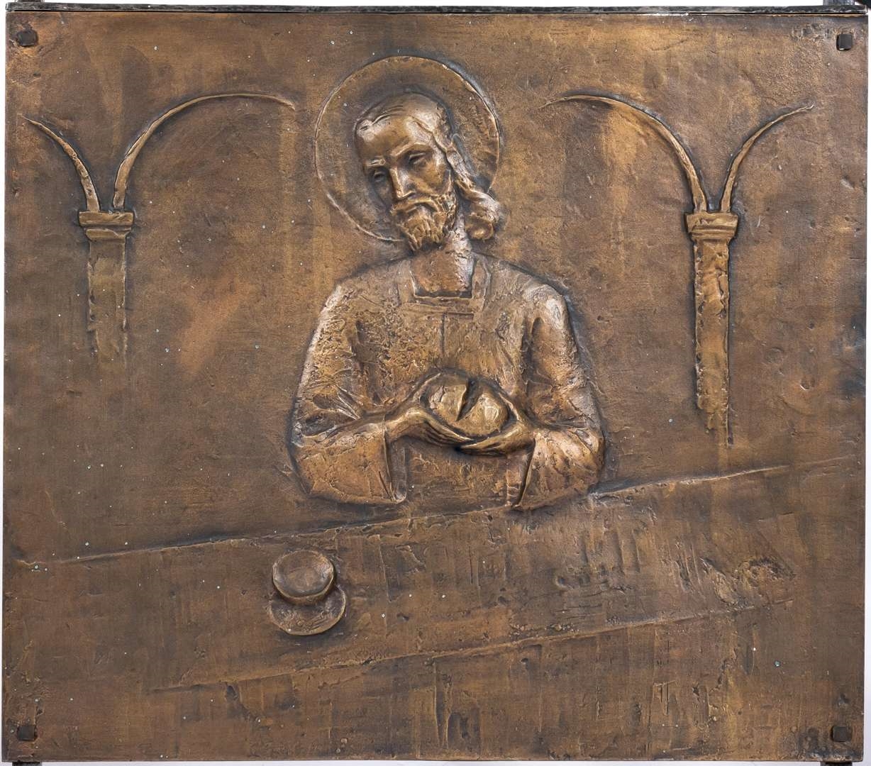 Artwork by Cephas Stauthamer, Representation of Jesus breaking bread at the Last Supper, Made of bronze and wrought-iron screen