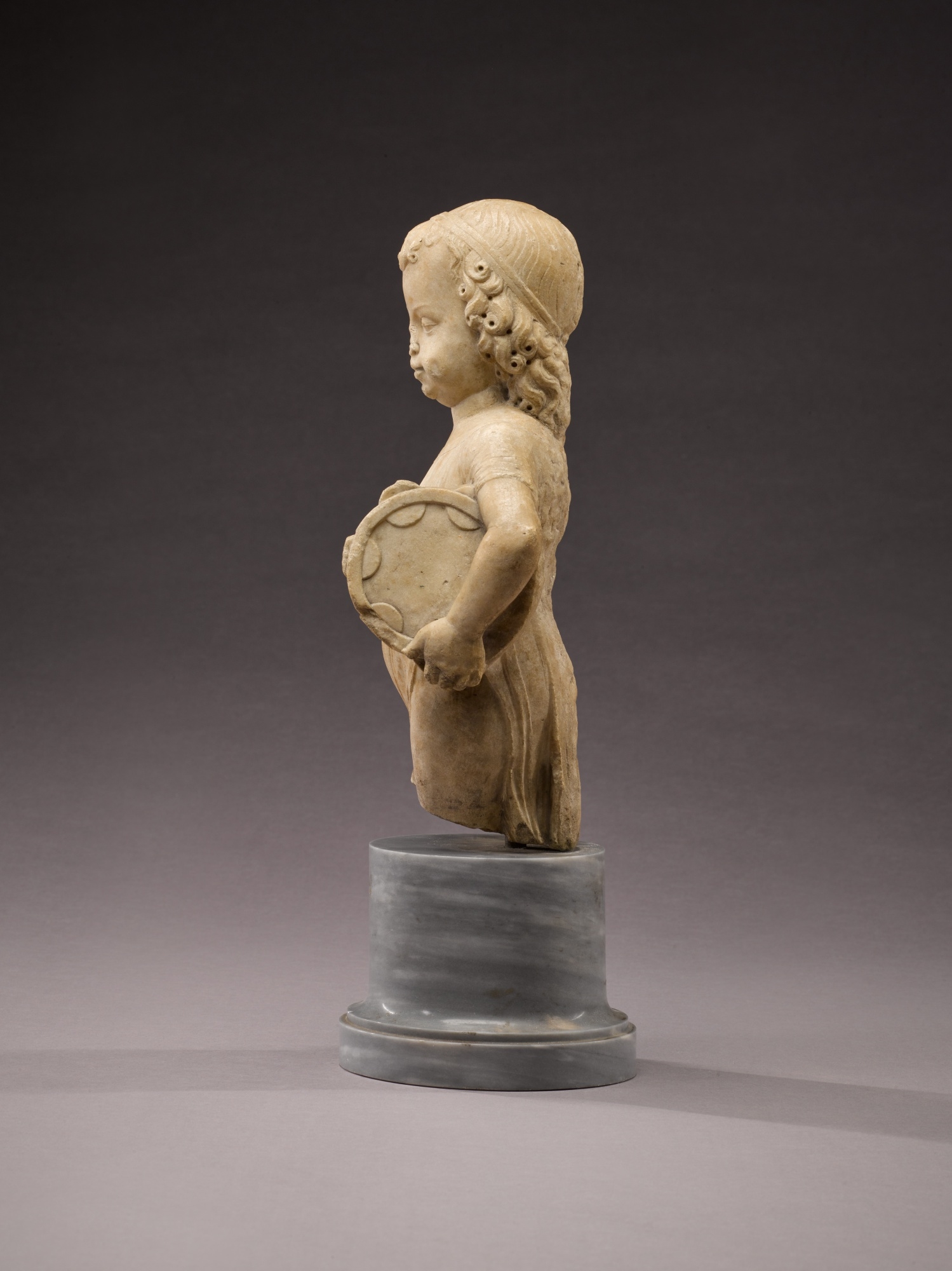 Artwork by Antonio Rizzo, Child with tambourine, Made of marble, on a later grey marble base