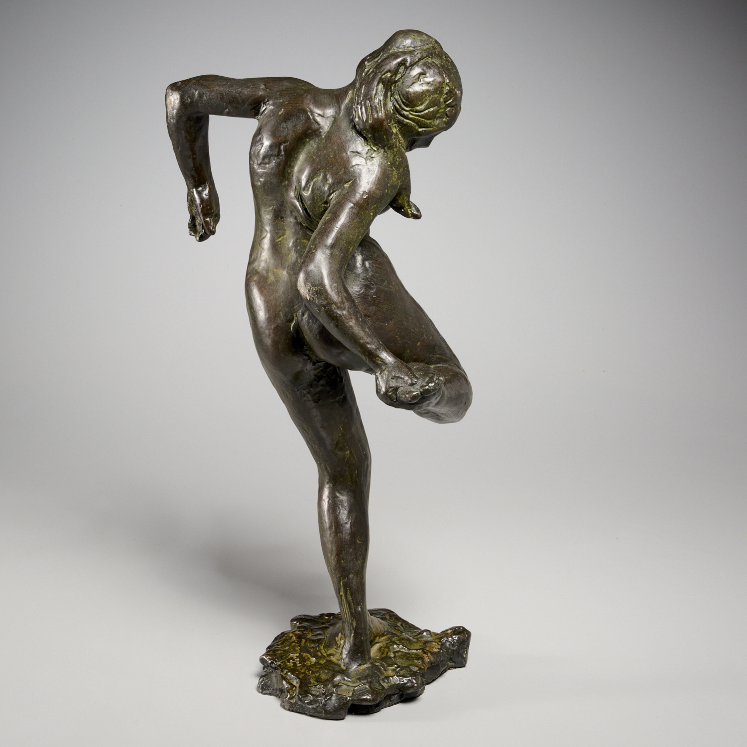 Artwork by Edgar Degas, "Danseuse regardant la plante de son pied droit" (Dancer looking at the sole of her right foot), Made of bronze