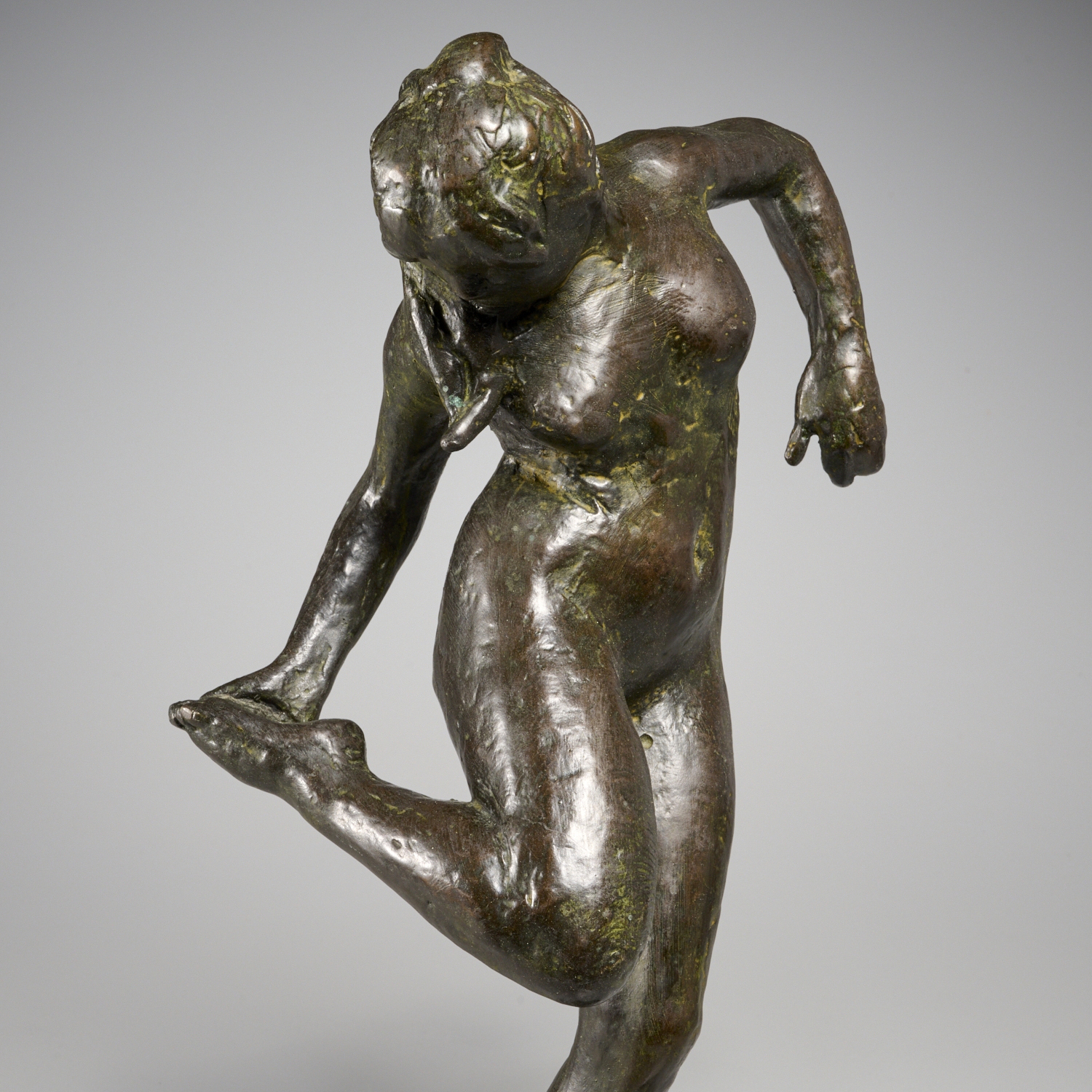 Artwork by Edgar Degas, "Danseuse regardant la plante de son pied droit" (Dancer looking at the sole of her right foot), Made of bronze