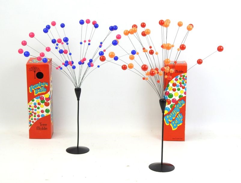 Two orange-red and violet-pink ball metal table mobiles on tulip bases by Laurids Lonborg