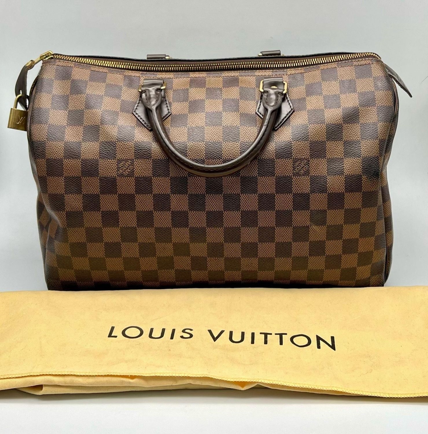 Louis Vuitton | A Louis Vuitton Speedy Canvas Monogram Bag with ...
