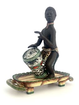 Man playing bongo drum - Petros Gumbi