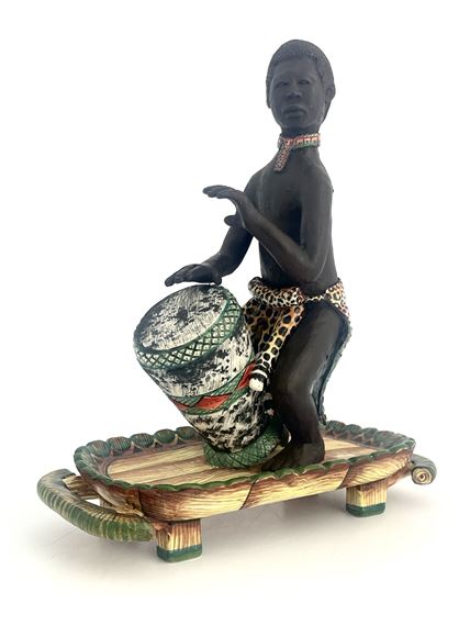 Man playing bongo drum - Petros Gumbi