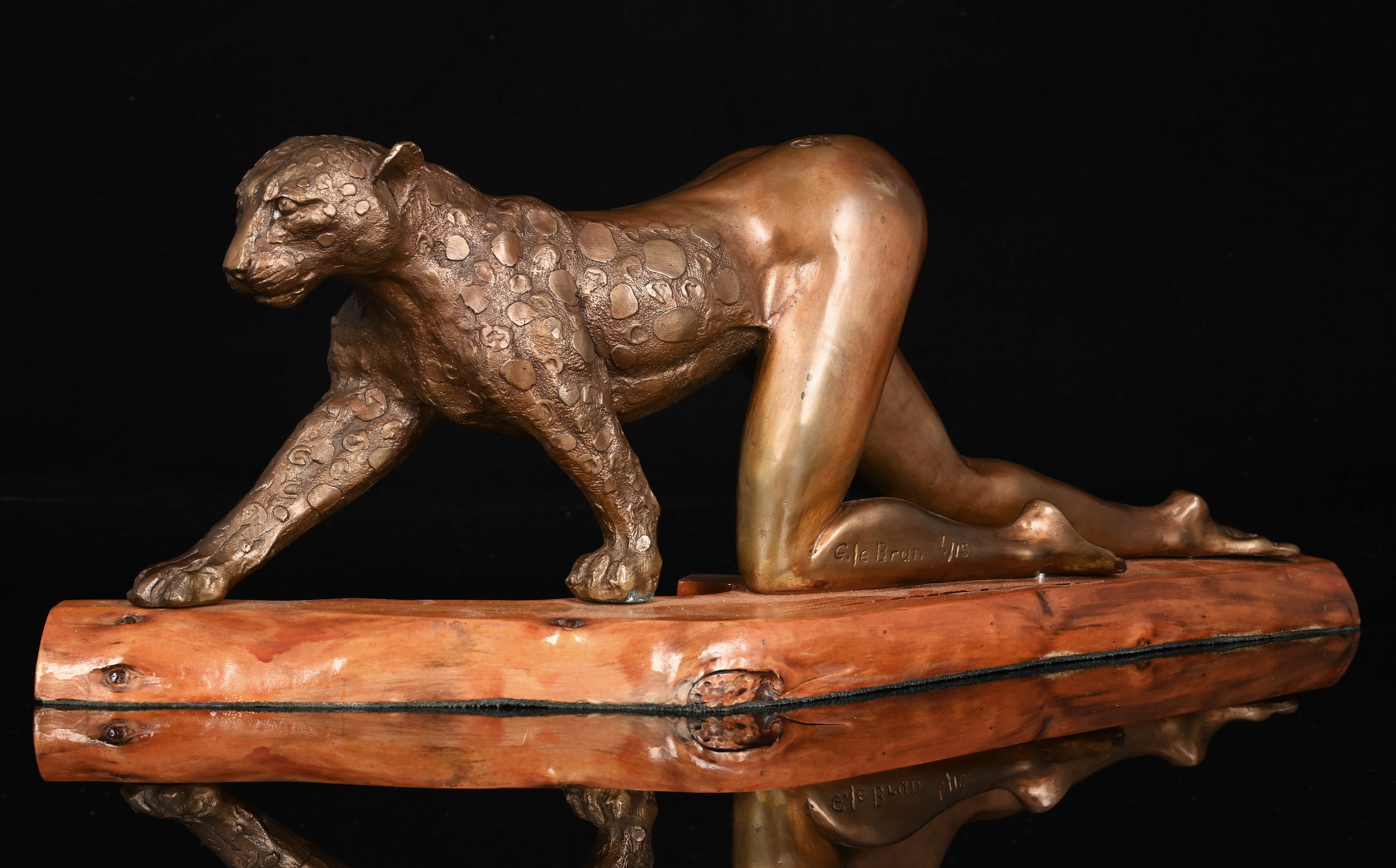Artwork by Gile Brun, Anthropomorphic Woman Leopard, Made of bronze cast mounted on a wooden base