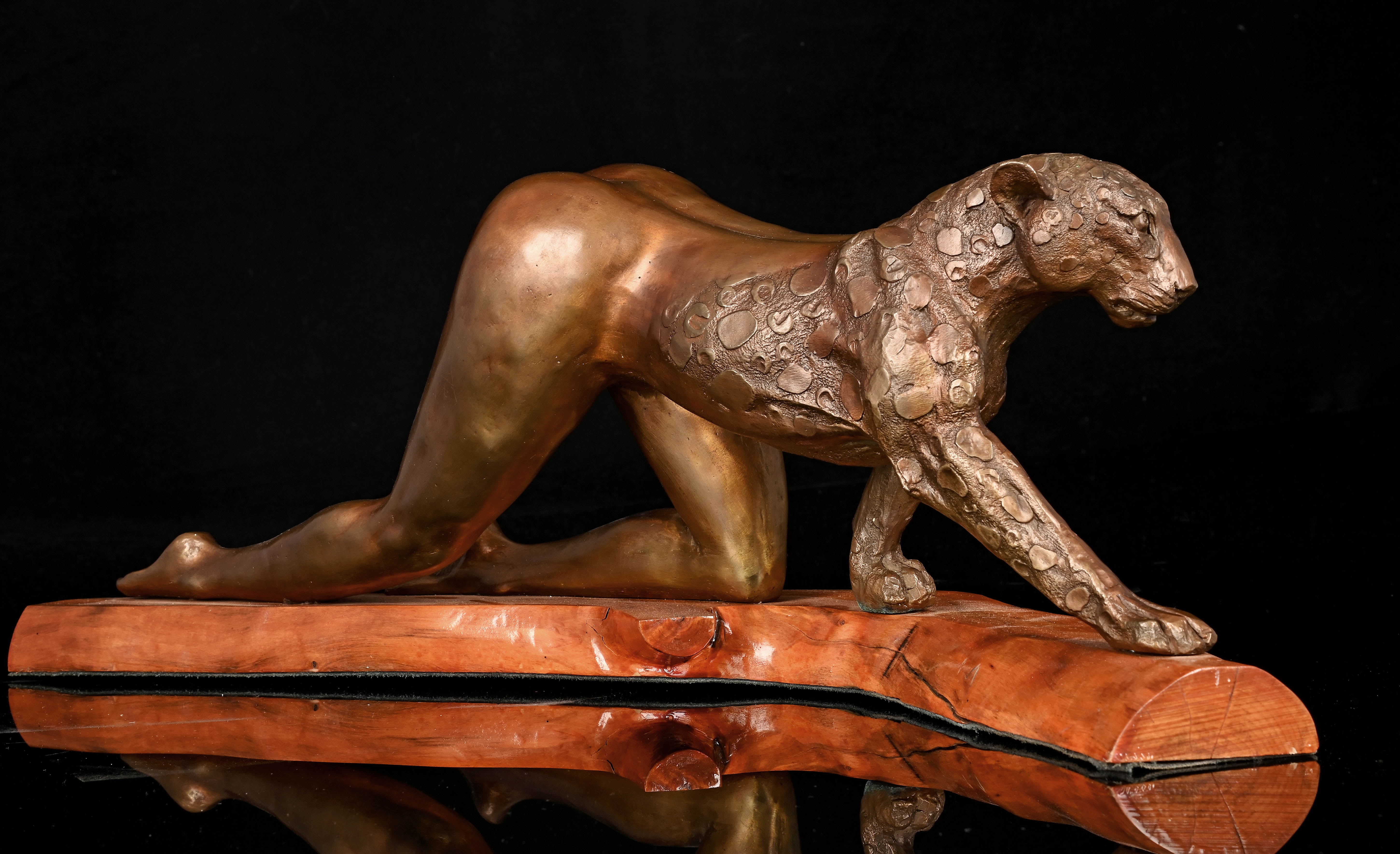 Artwork by Gile Brun, Anthropomorphic Woman Leopard, Made of bronze cast mounted on a wooden base